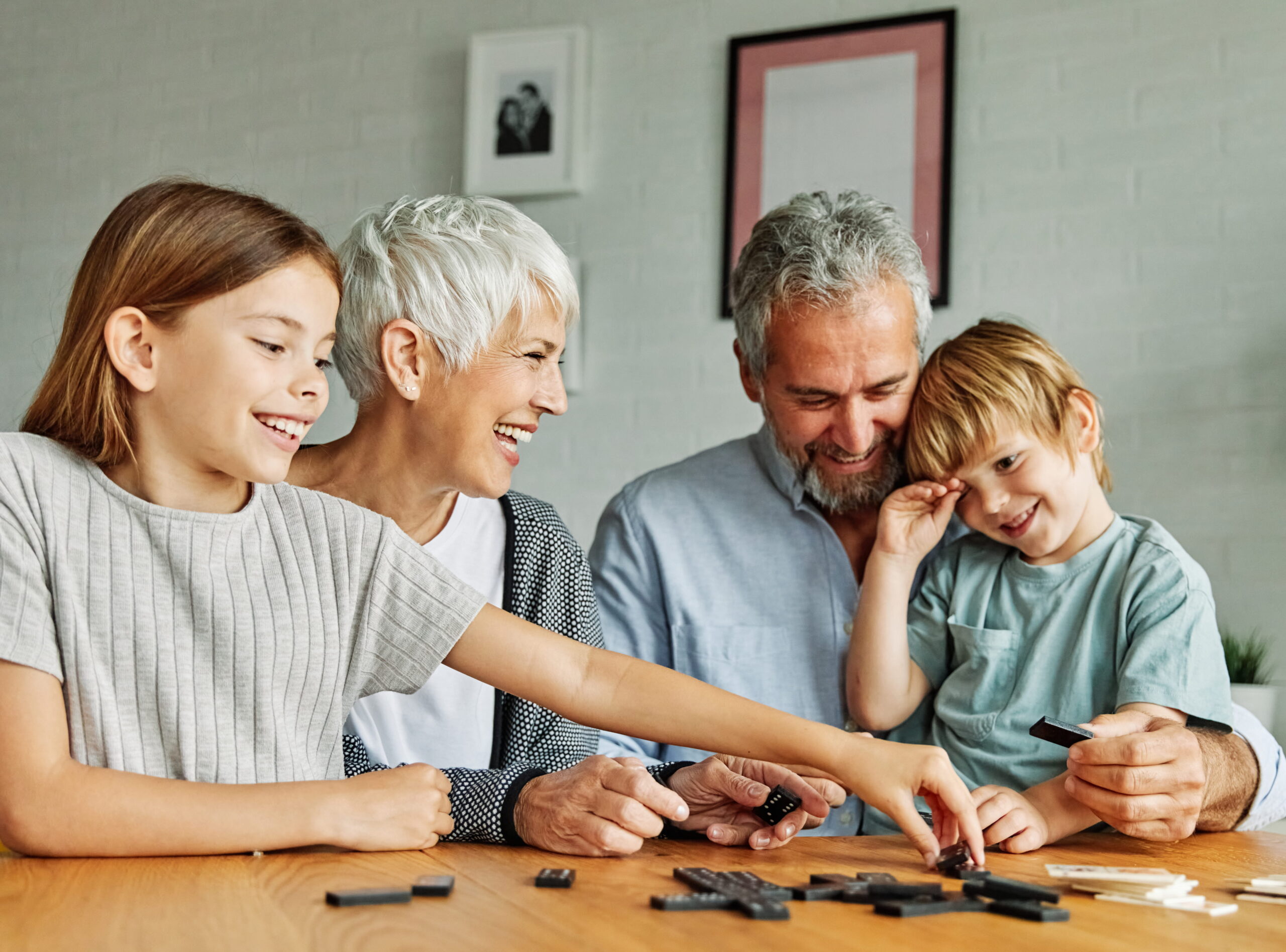 Best Living Annuities in South Africa (Elderly couple playing with grandchildren)