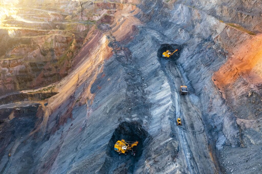 Large mining area with mining equipment - Everest Wealth