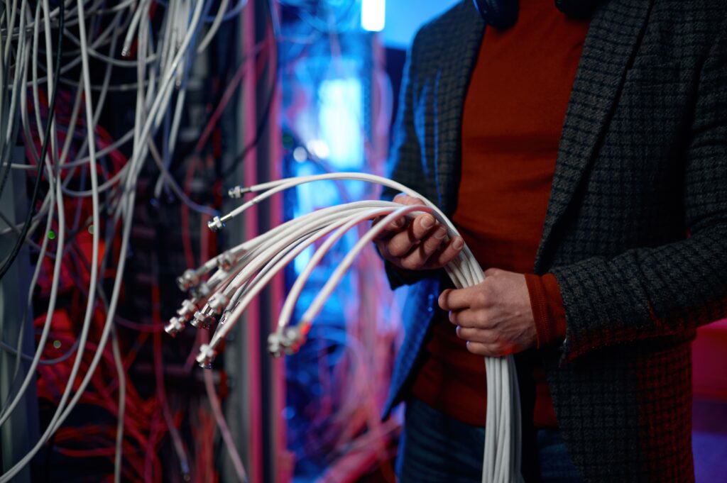 Man holding fibre cables for Maroela Media fibre connections - Everest Wealth
