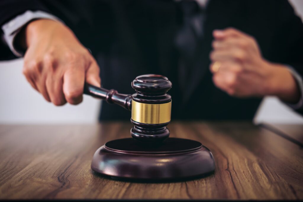 Judge hitting a gavel in a courtroom - Everest Wealth