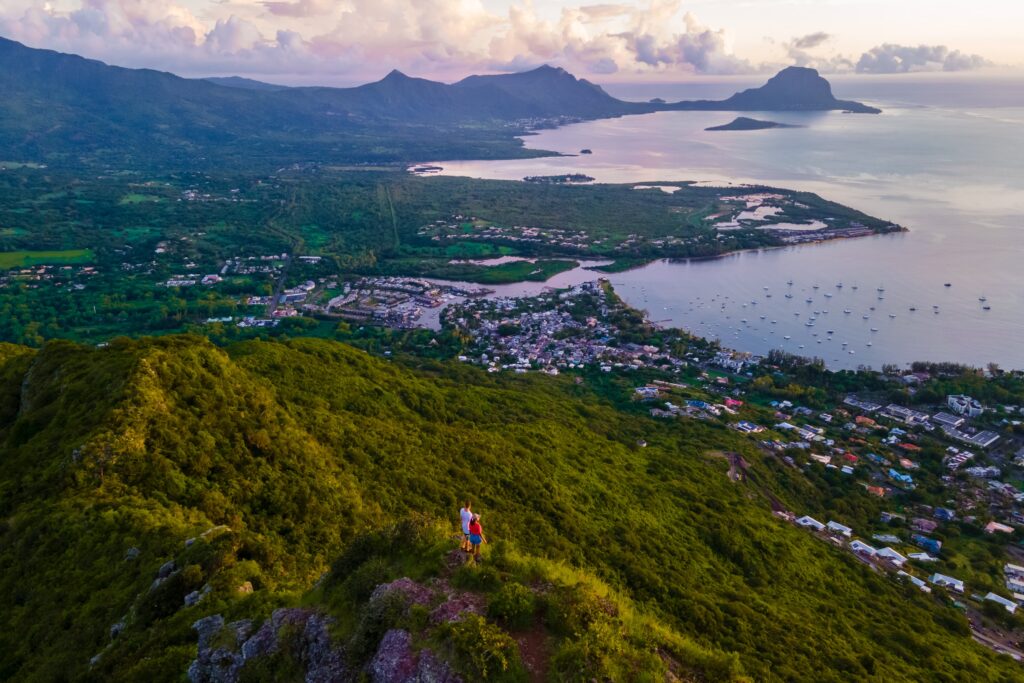 Man and woman standing on a viewpoint in Mauritius - Everest Wealth