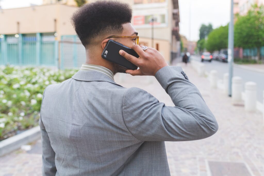 Young man usig Vodacom "Please call me" service