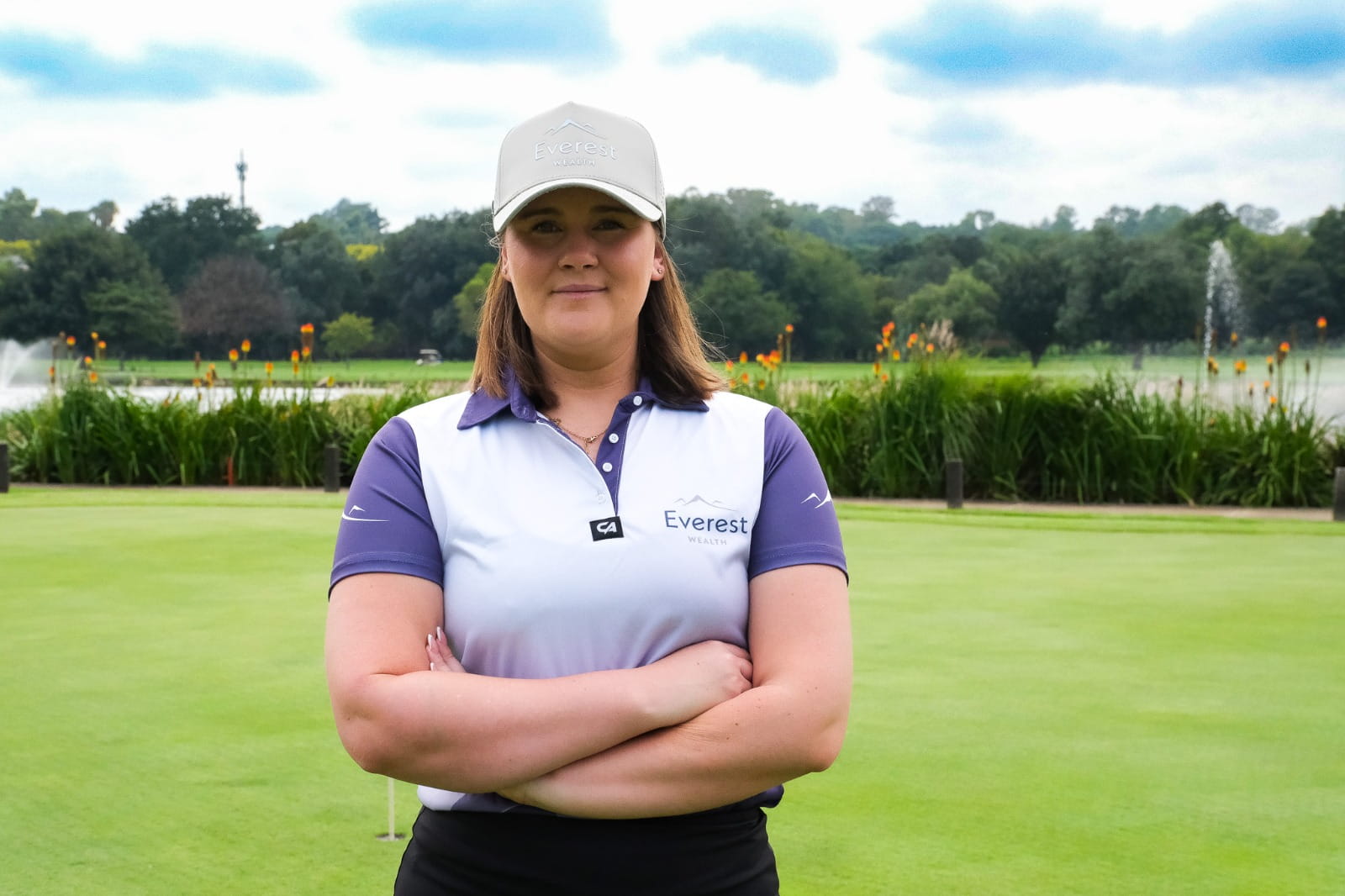 Professional Golfer Shawnelle de Lange wearing white & purple Everest Wealth polo
