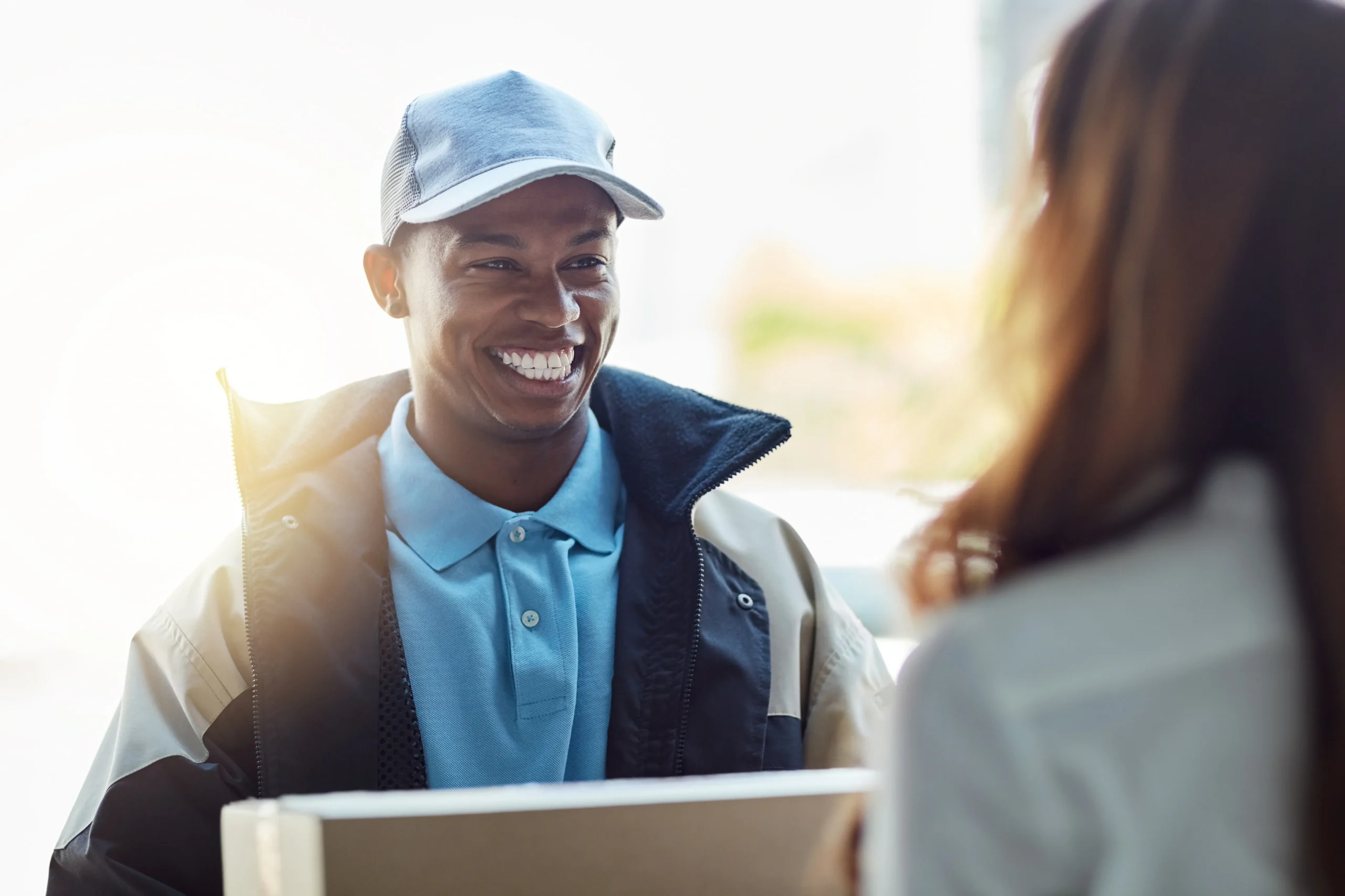 Markets Recover and Best Before Expands (courier delivery man handing over a package to a woman)