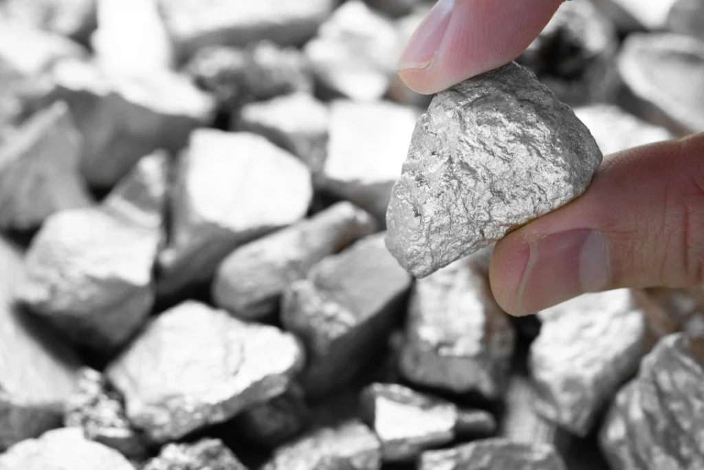 Stronger Rand Boosts Travel (person holding a piece of platinum)