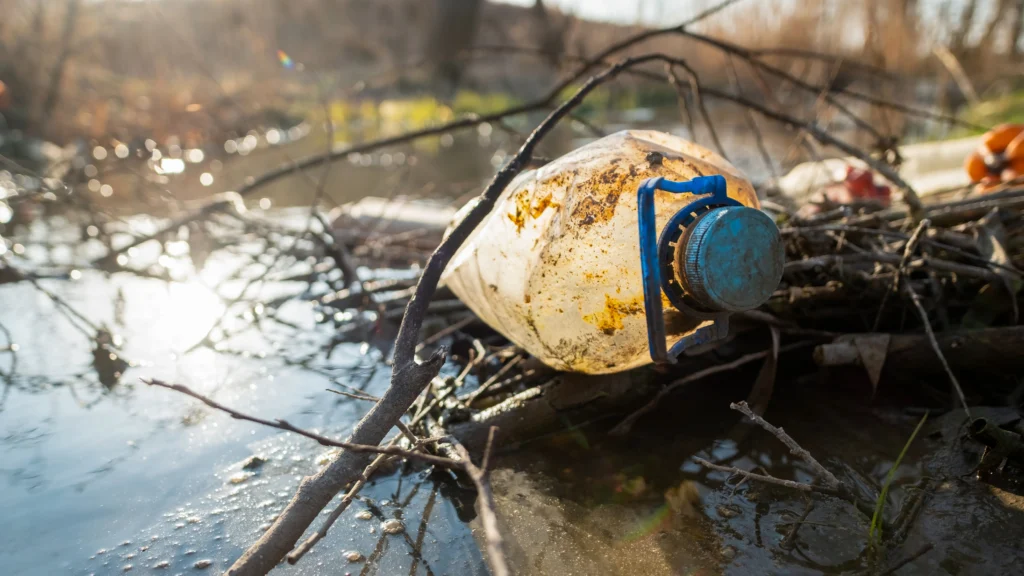 Volkswagen Warns on South Africa’s Future (Dirty plastic bottle in a river)