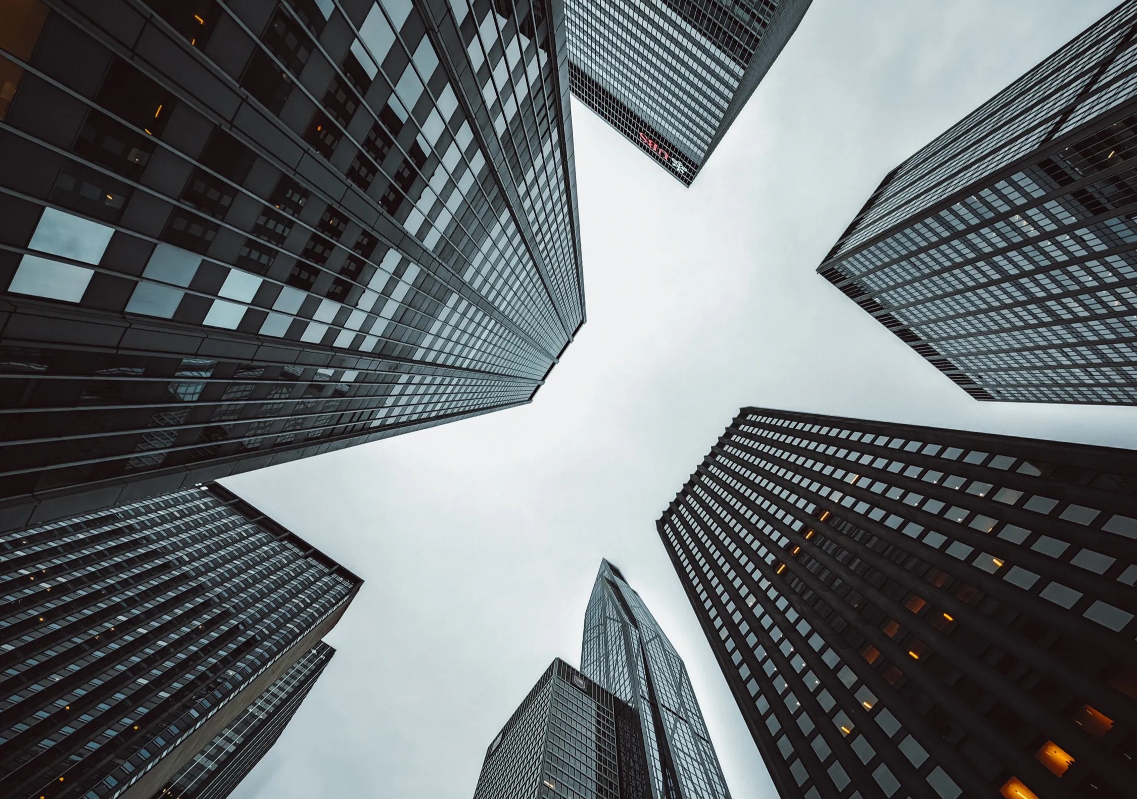 Markets Tumble as Companies Reset (Low angle view of Skyscrapers)