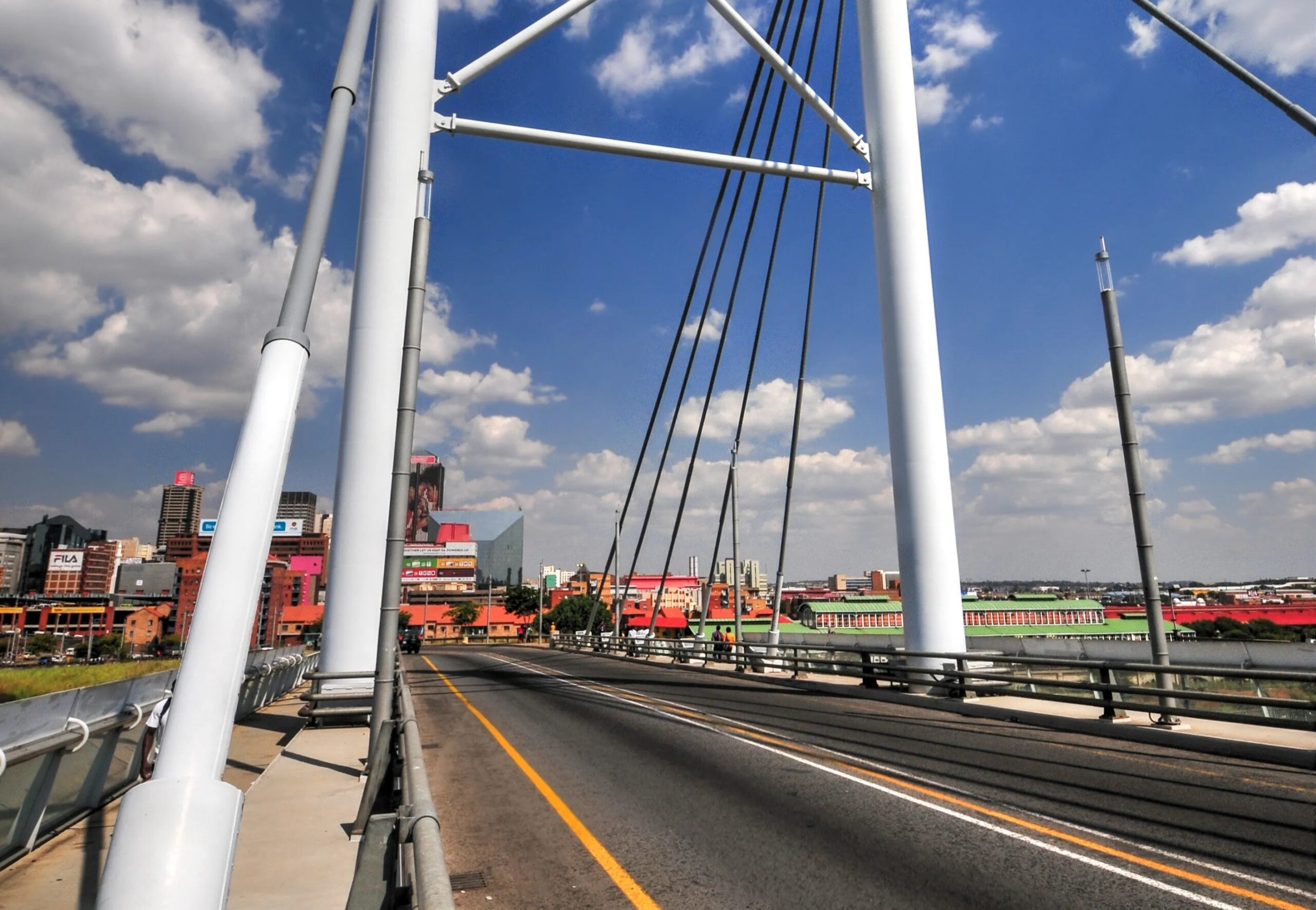 War Abroad & Pressure at Home (view of a city from a bridge)