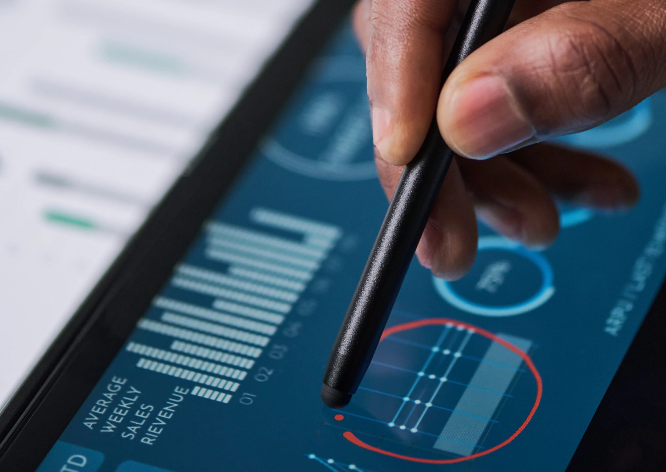Markets Slide as Commodity Weakness Bites (Person editing financial graphs)