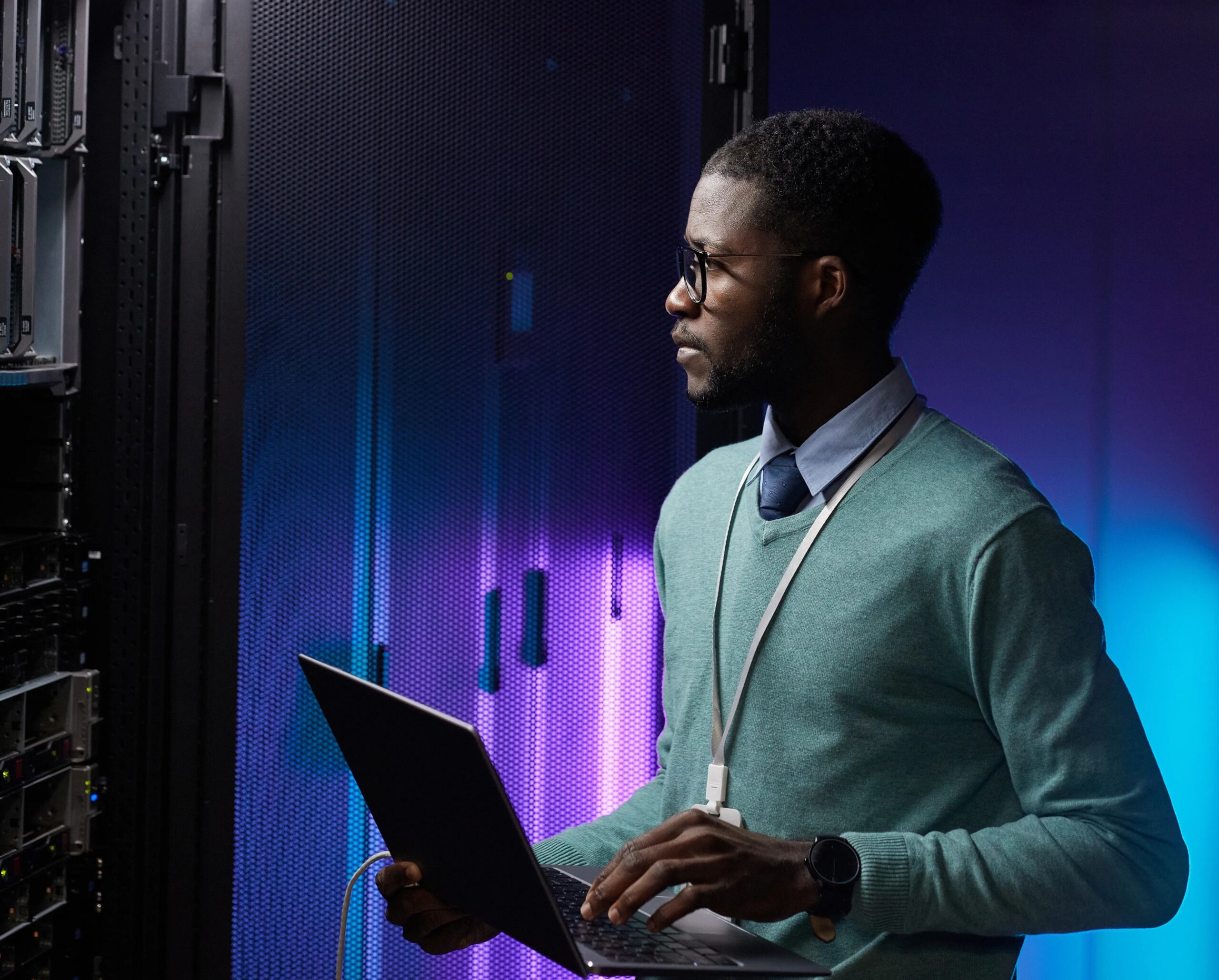 Moody’s Exits SA Ratings Register (man holding a laptop and looking at a large server cabinet)