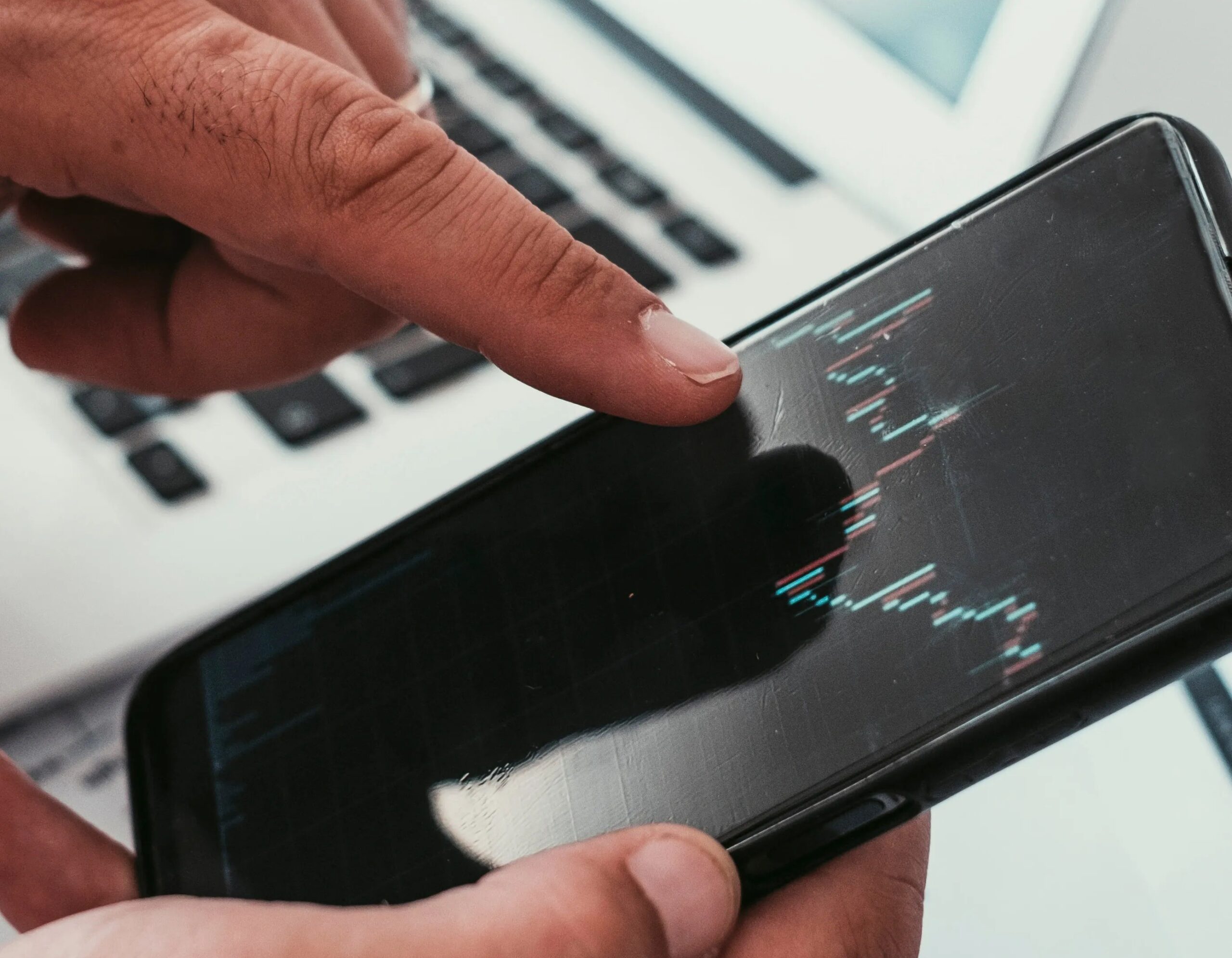 JSE Slips as Mining and Financials Weigh (stock information displayed on a phone screen)