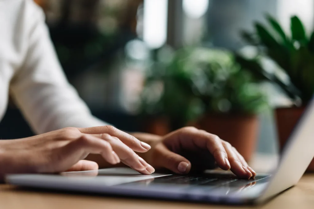 Auto-Assessments and Tax Season (person typing on a laptop)